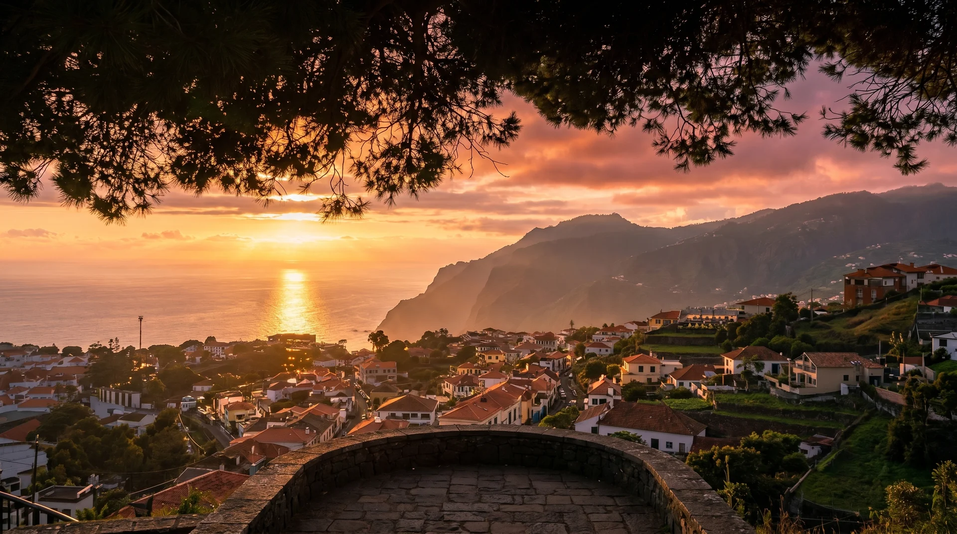 Funchal cityscape and bay at golden hour from Pico dos Barcelos, Madeira