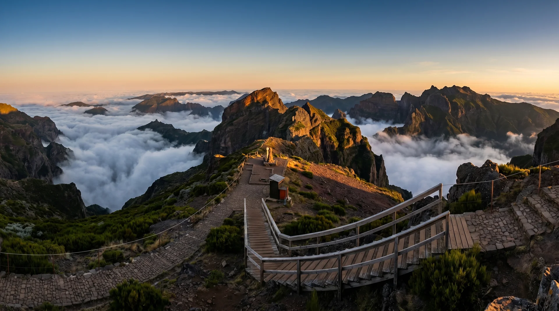 Sunrise casting golden light over Madeira's mountain peaks